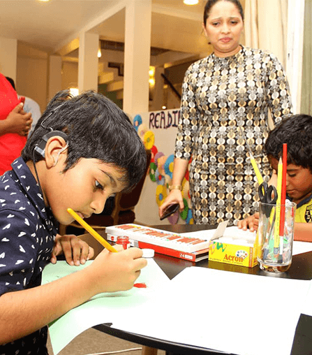 Child undergoing speech and communication practice at Wickramarachchi Hearing Care